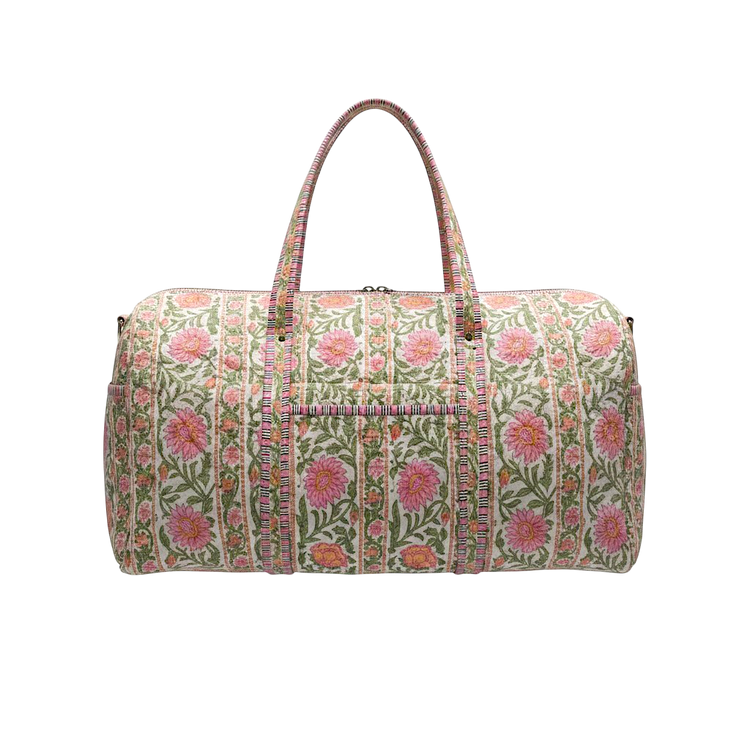 Quilted duffel bag in the Gabby pattern featuring pink floral designs and green leaves.