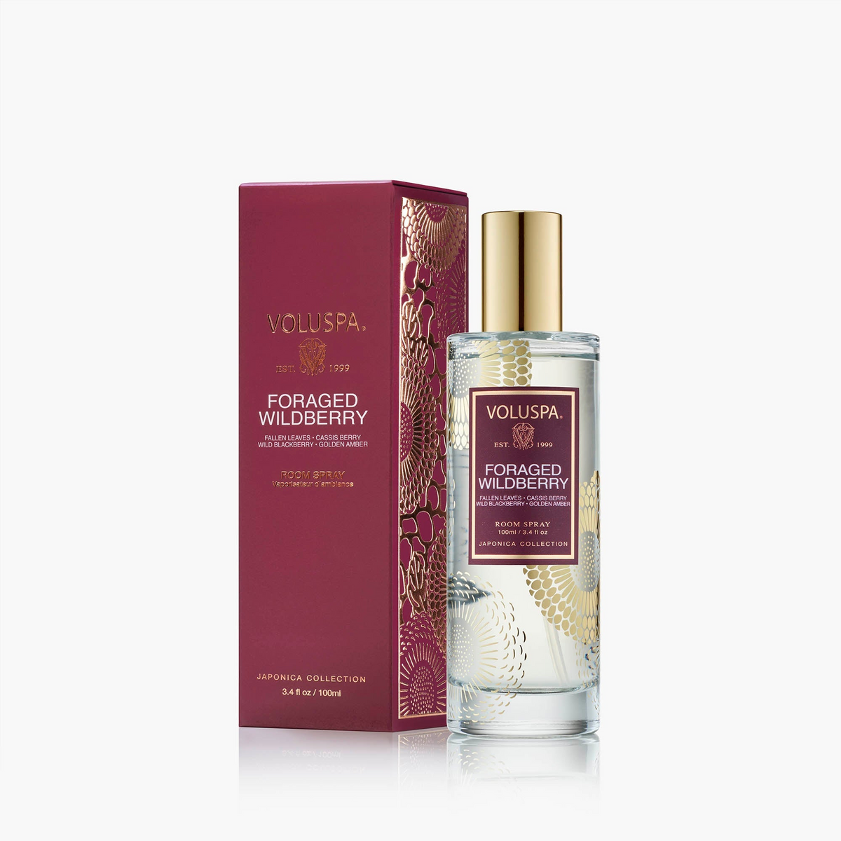 Foraged Wildberry Room Spray in a 3.4 fl oz glass bottle next to its burgundy and gold box.