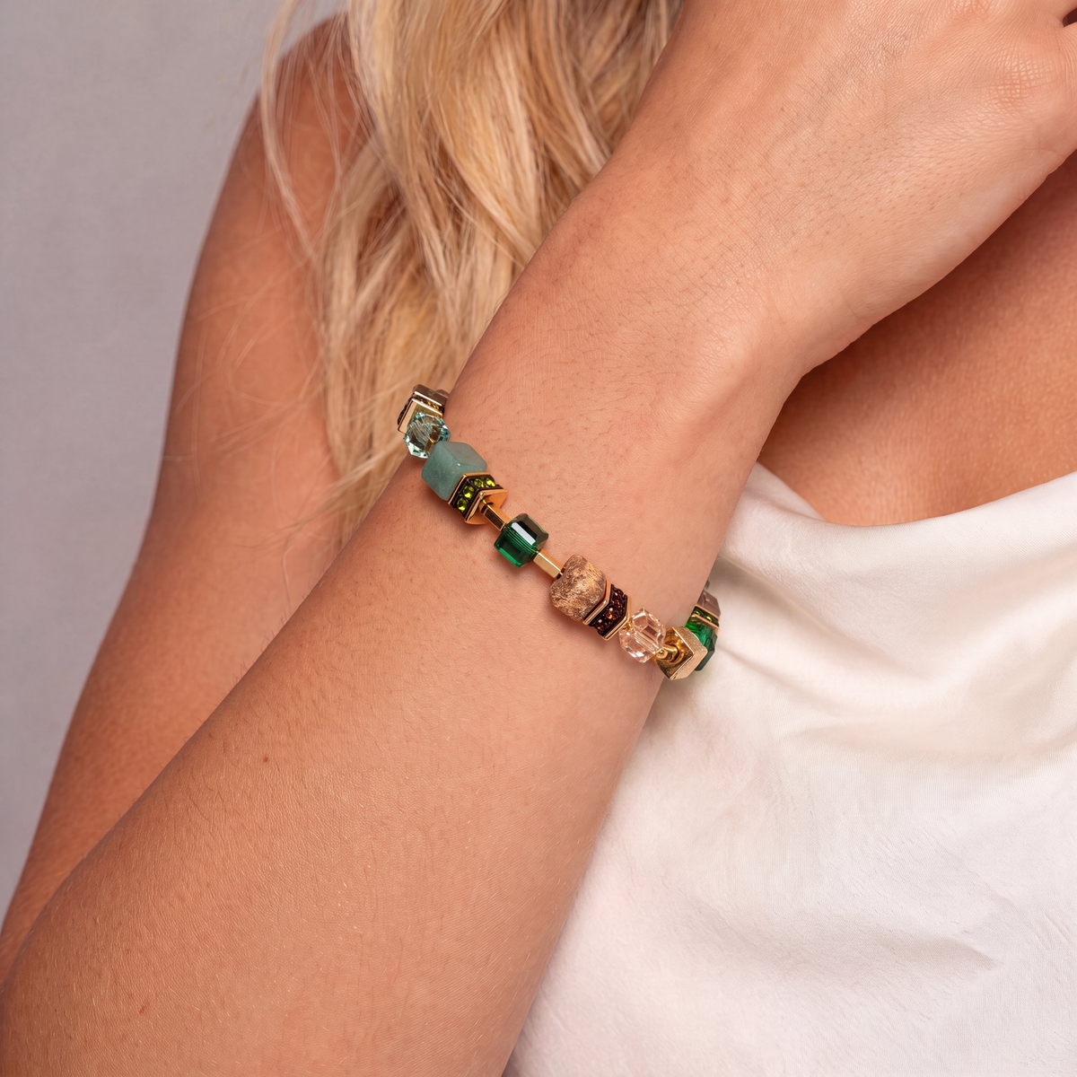 GeoCUBE Precious Statement Bracelet Emerald Garden with green and earth-toned gemstone cubes.