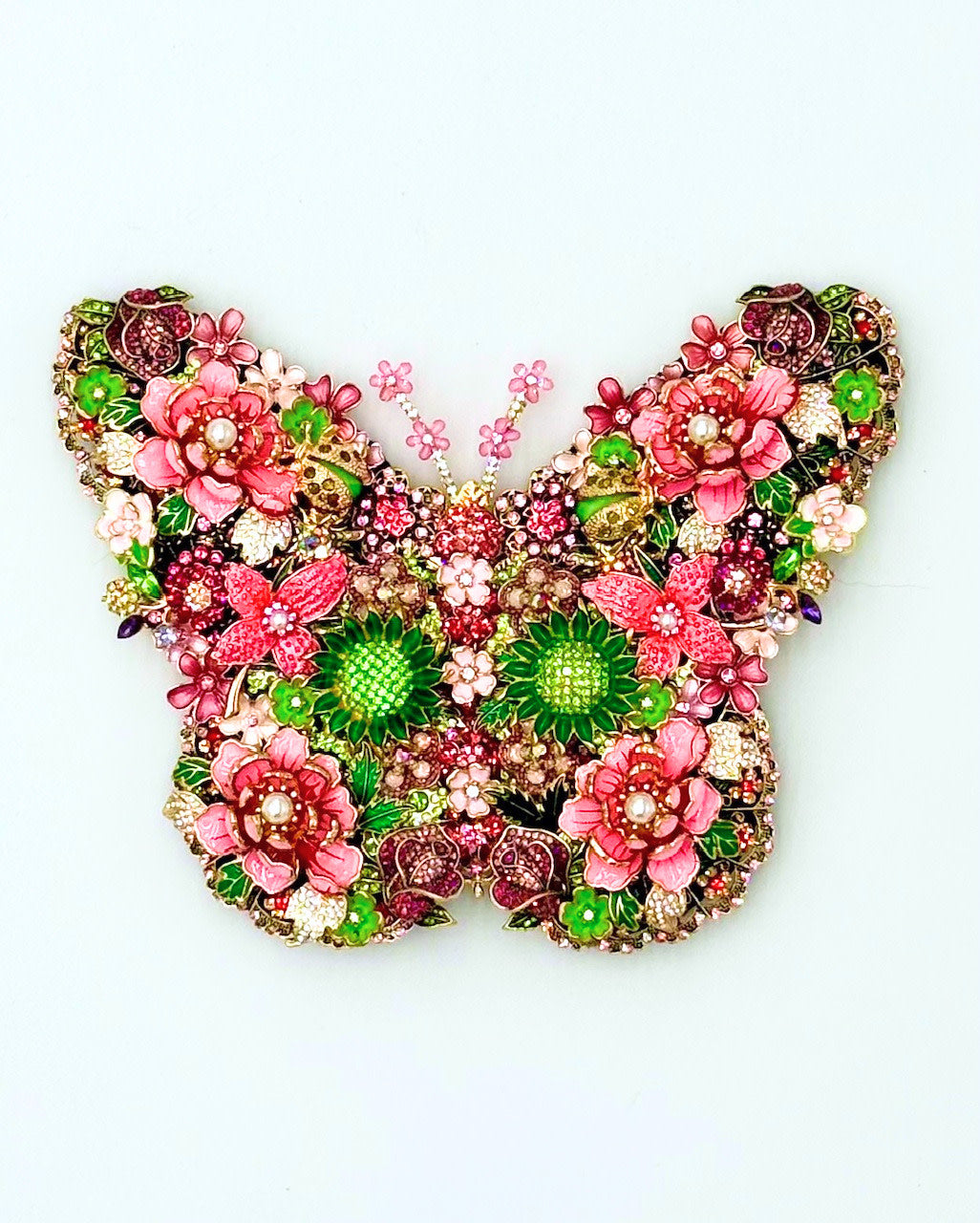 Handmade Merry Everything Butterfly wall decor in a natural wood finish with delicate butterfly silhouette and floral pattern.