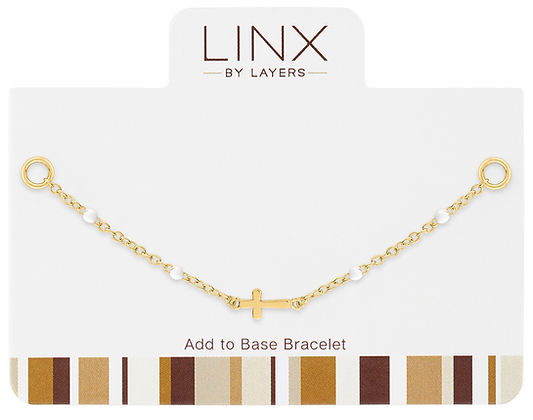 Gold petite white beaded cross LINX add-on bracelet component on a display card.