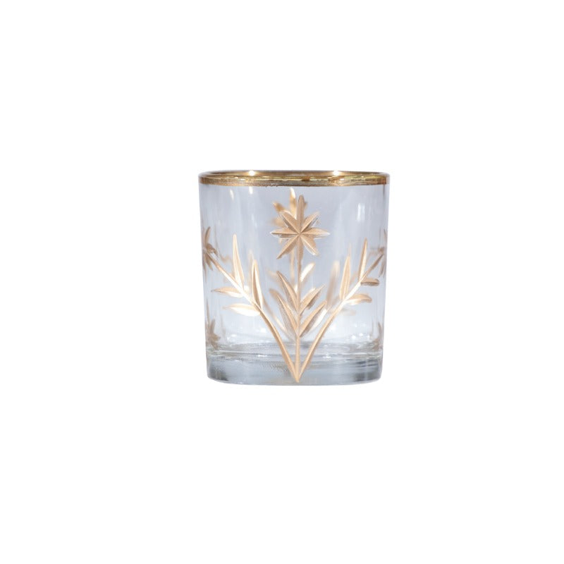 Hand-painted etched glass votive holder with gold botanical star design and rim.