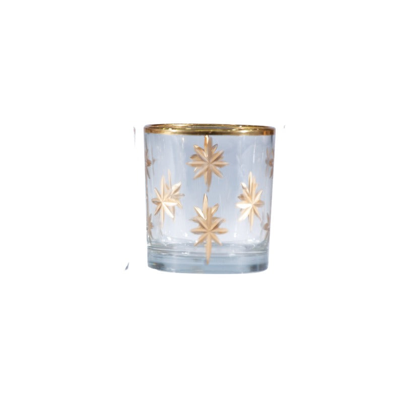 Hand-painted etched glass votive holder with gold starburst designs and a gold rim.