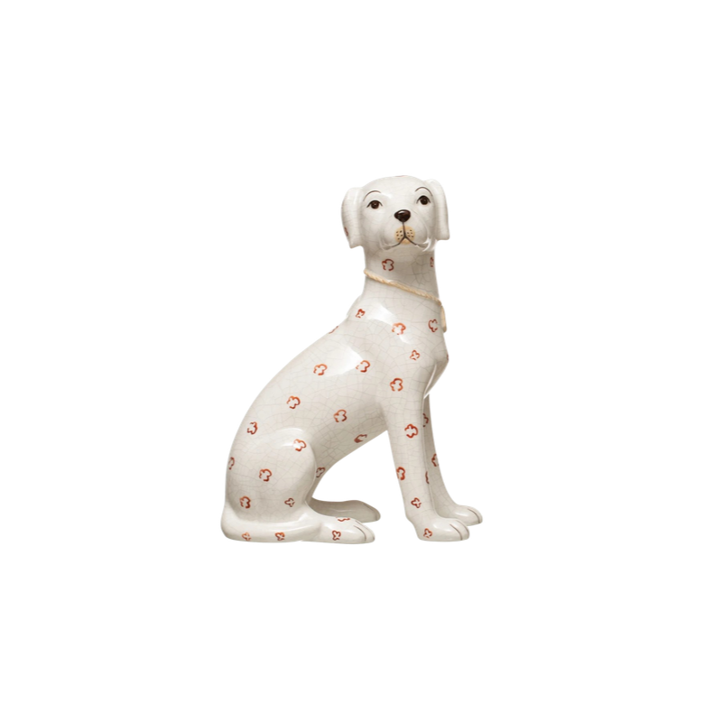Hand-painted ceramic dog figurine with a crackle glaze and orange floral patterns.