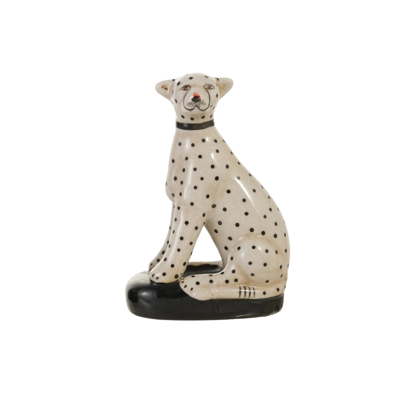 Hand-painted vintage reproduction stoneware cheetah figurine in white with black spots.