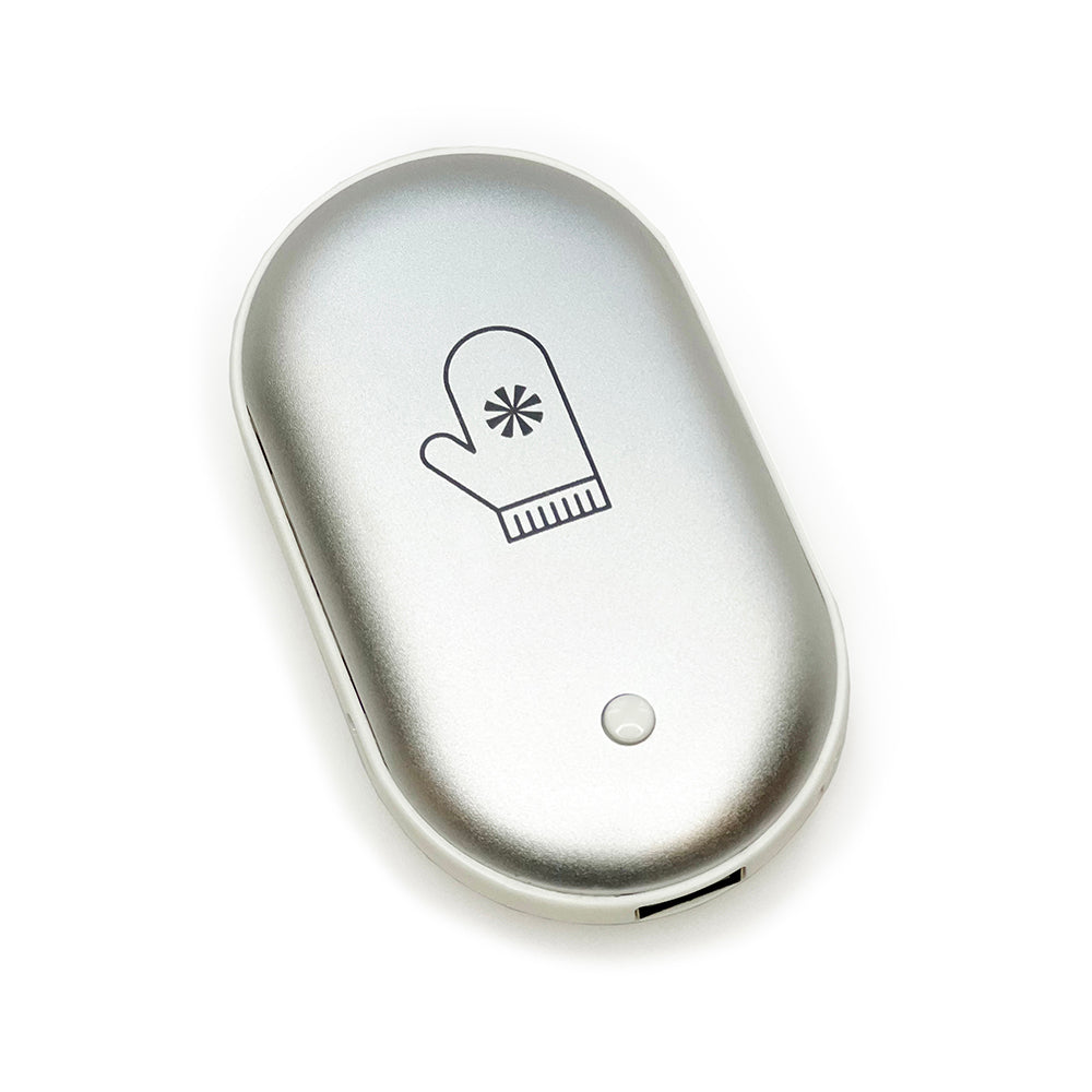 Silver oval hand warmer with a black mitten and snowflake icon, and a small indicator light.