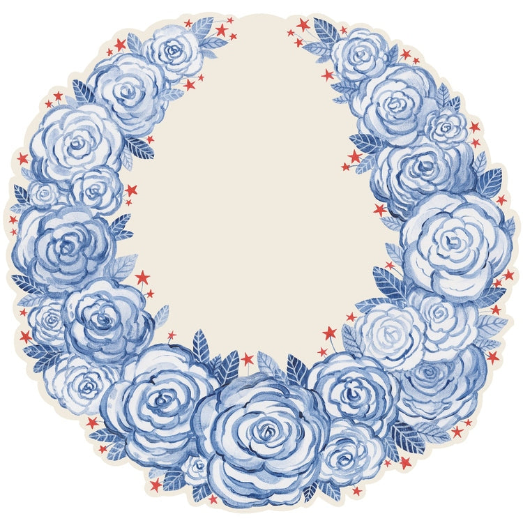 Die-cut circular paper placemat featuring a hand-painted blue floral wreath with small red stars.