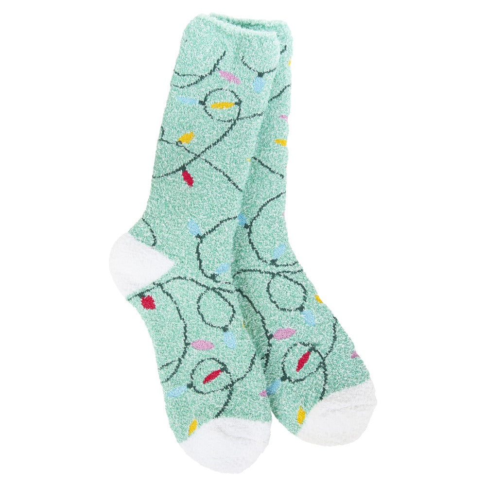 Mint green plush crew socks with a colorful holiday string light pattern and white heels and toes.