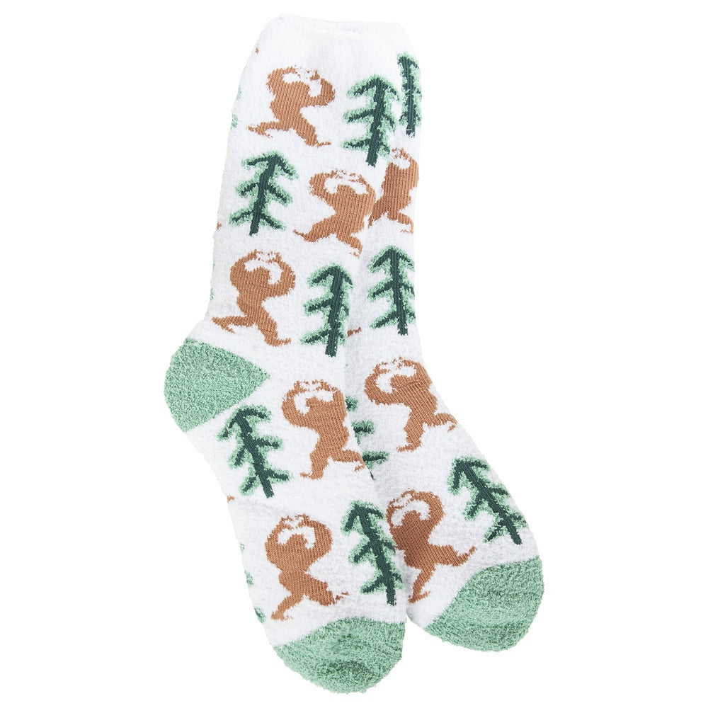 White plush crew socks with a pattern of brown Sasquatch figures and green pine trees.