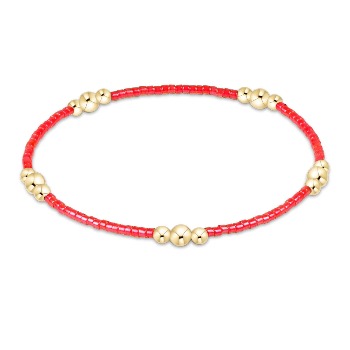 Gold-filled seed bead bracelet with a subtle geometric pattern on elastic cord.