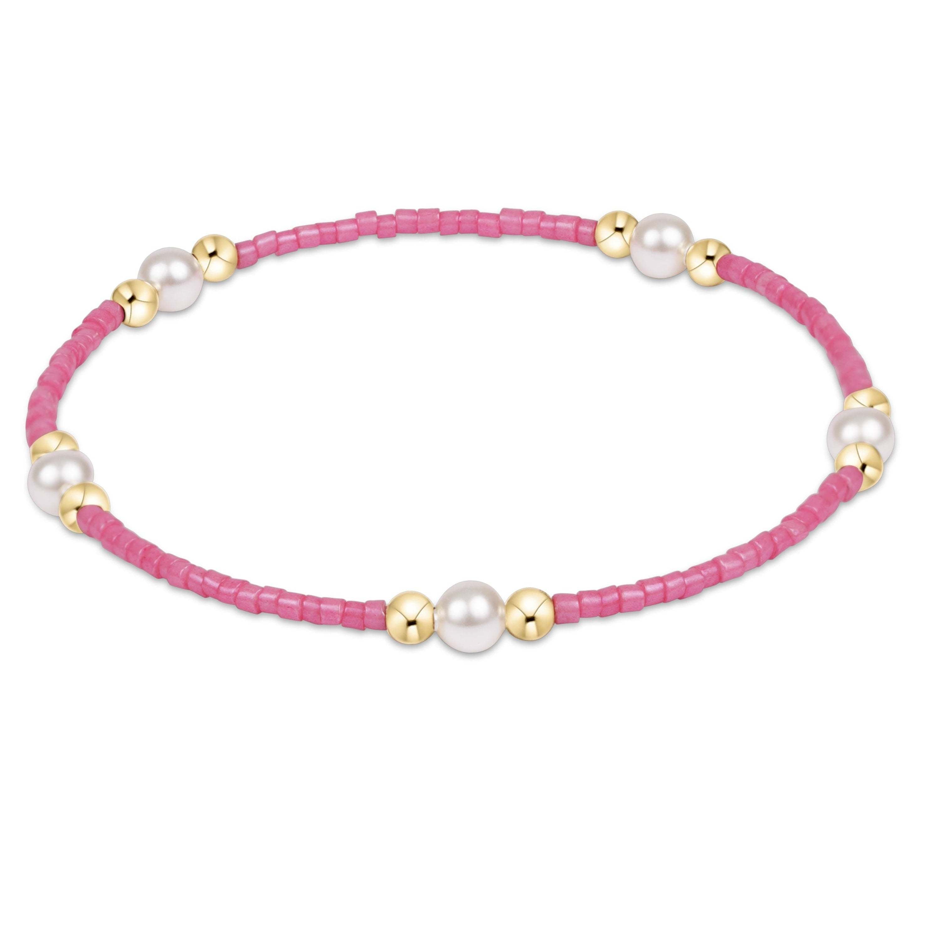 Hand-beaded Hope Purpose bracelet in bubblegum pink with gold accents and pearls on elastic cord.