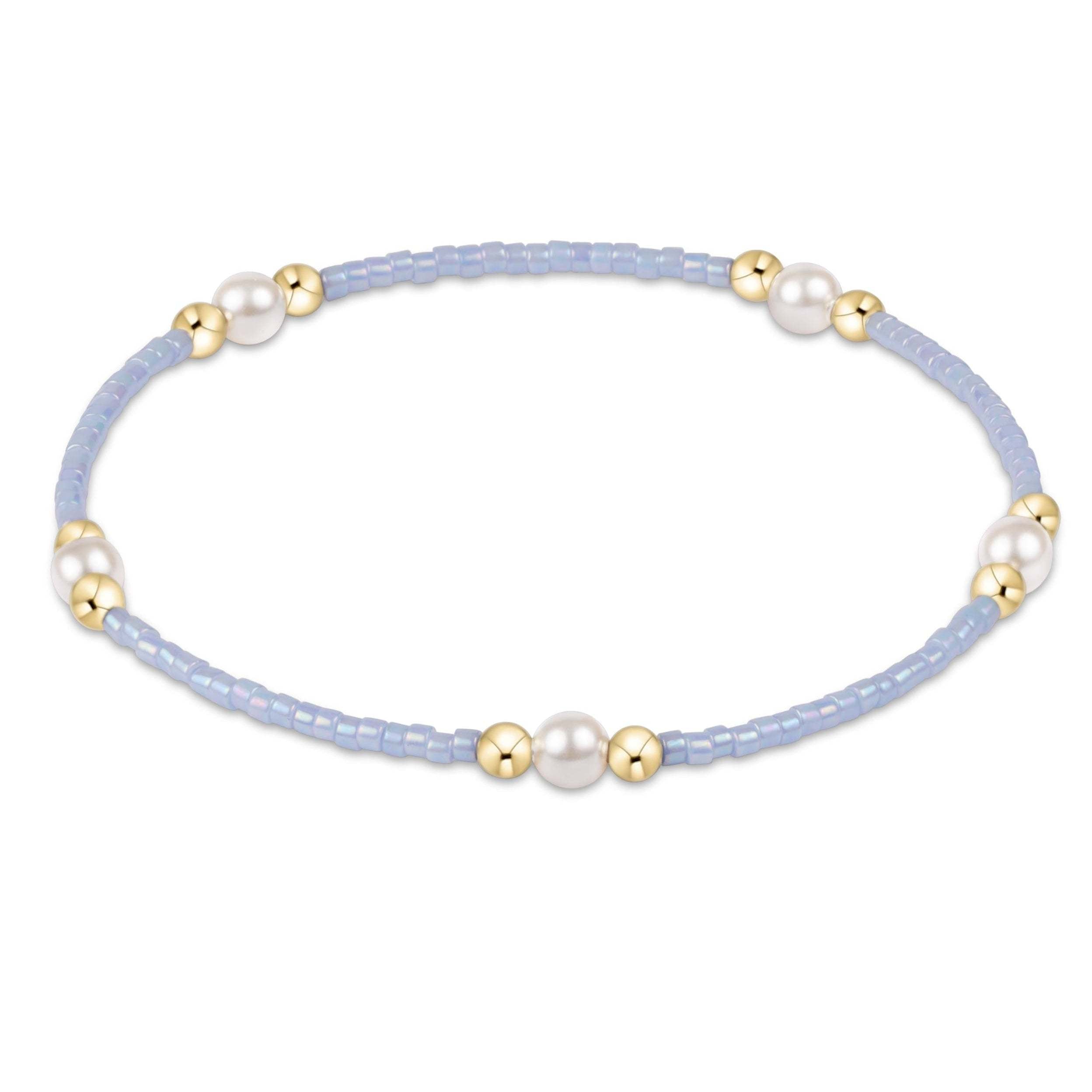 Hand-beaded Hope Purpose bracelet featuring a pearl seed bead pattern with gold-filled accents on elastic cord.