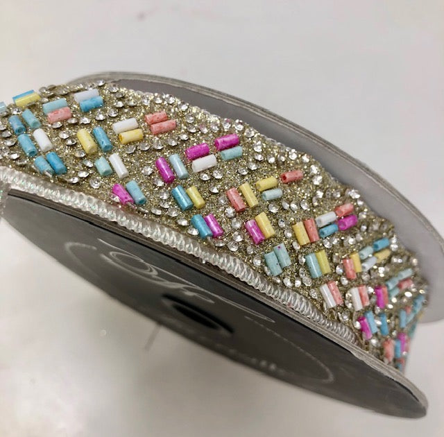 1 inch wide Diamond Sprinkles Multi Ribbon on a spool with colorful beads and clear rhinestones.