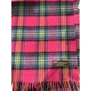 Pink plaid cashmere scarf with a fringed edge and a small rectangular label.