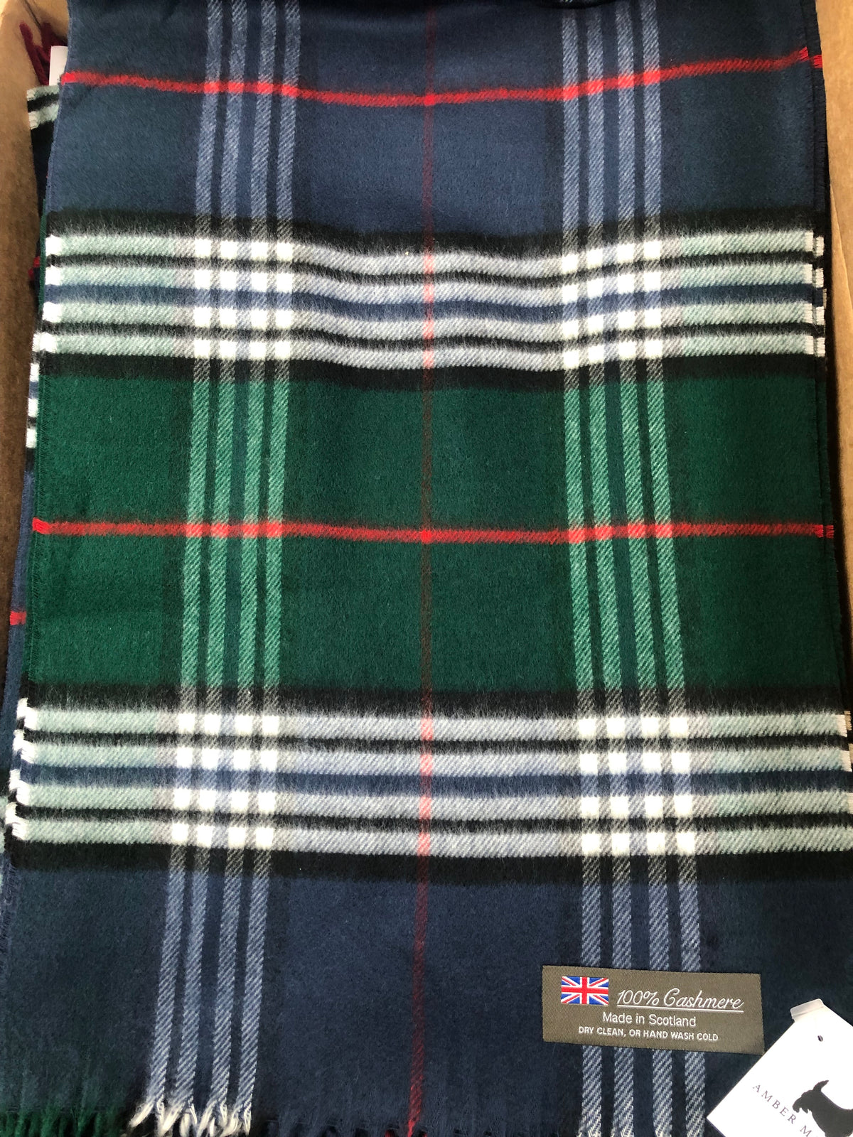 Green and blue plaid 100% cashmere scarf with a red stripe and white fringe, made in Scotland.