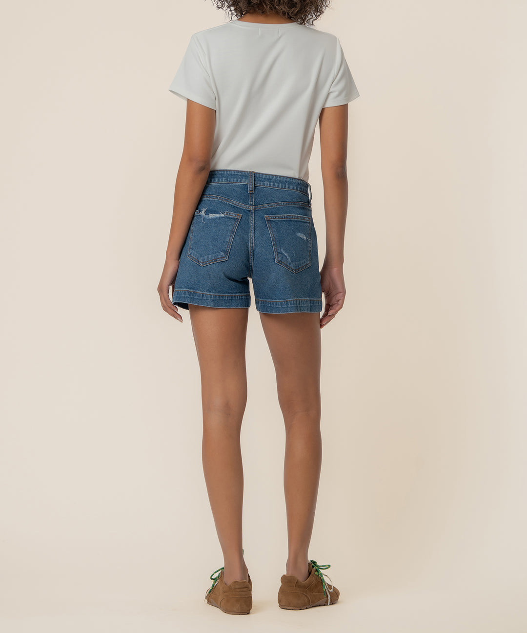 True back view of Jane high-rise shorts in True color with pork chop pockets
