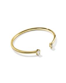 Mini Elton Luxe Cuff Bracelet in gold with two small white cubic zirconia stones at the ends.