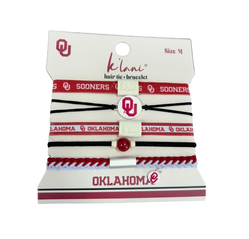 Set of five Oklahoma Sooners hair tie bracelets in red, white, and black on a display card.