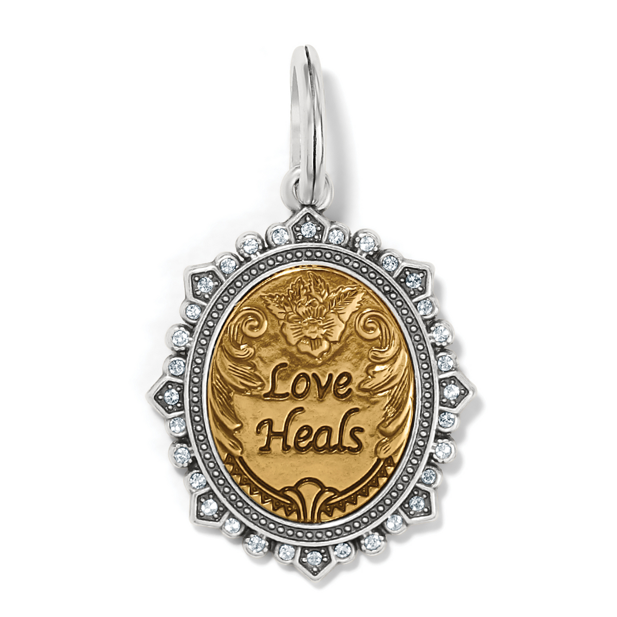 Two-tone Love Heals Amulet with gold center, silver crystal-accented border, and floral engraving.