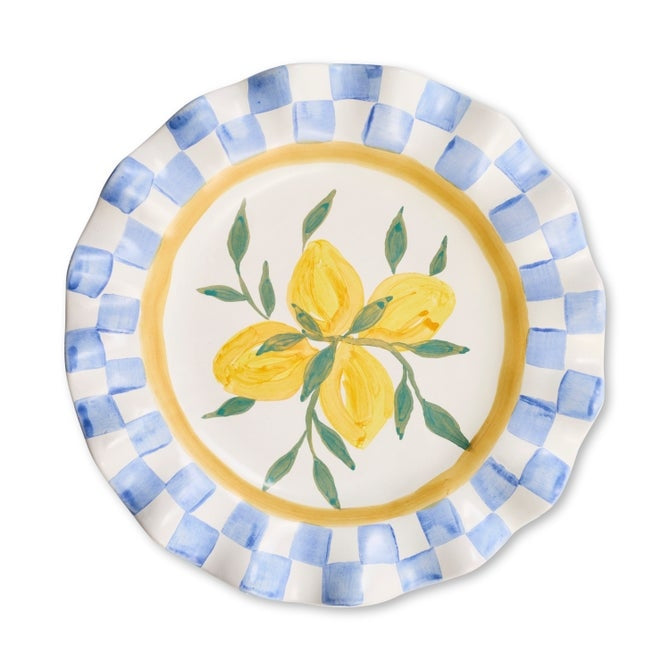 Ceramic cheese platter with a scalloped edge in off-white.
