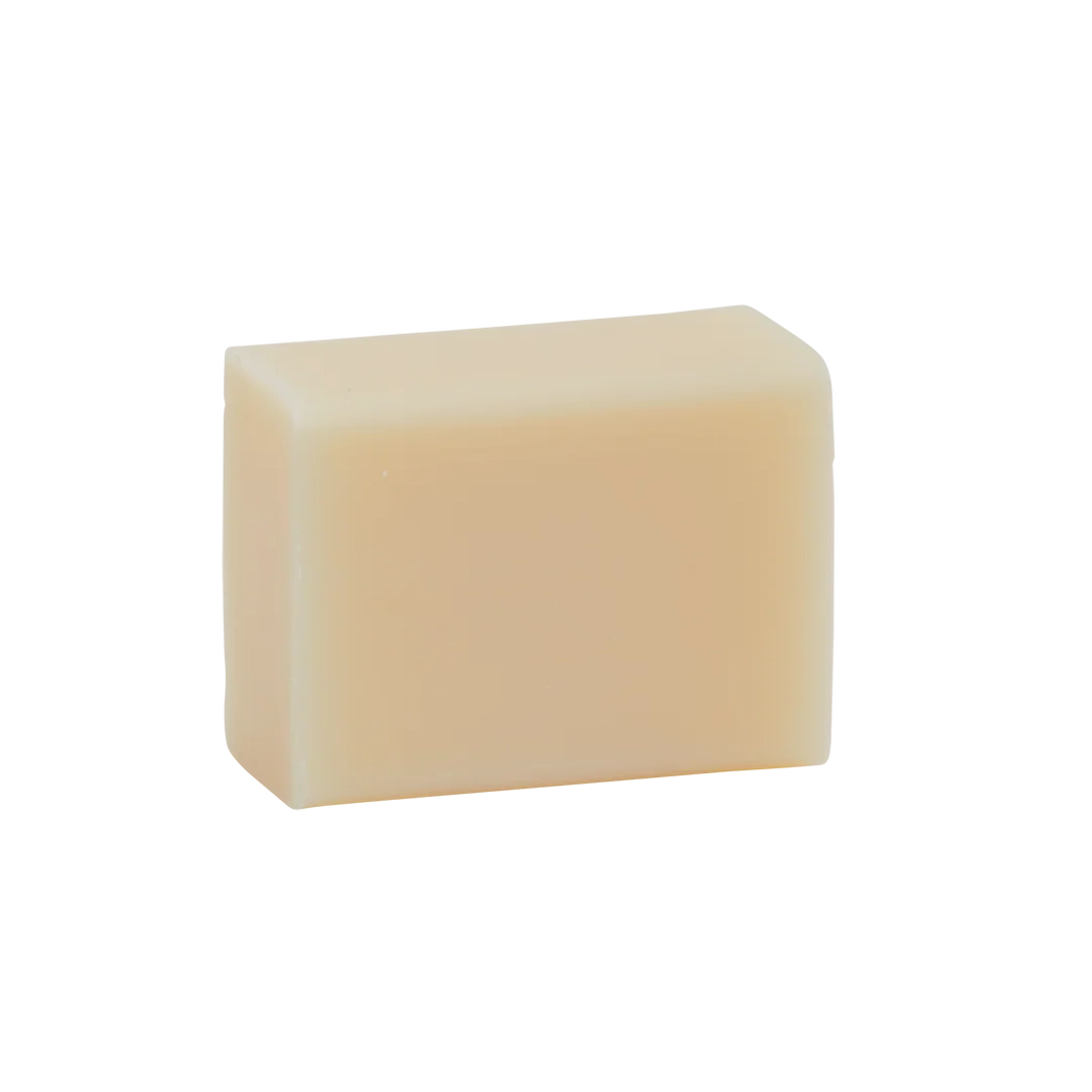 Rectangular bar of light beige Man Bar Mini Cedar & Sandalwood soap on a white background.