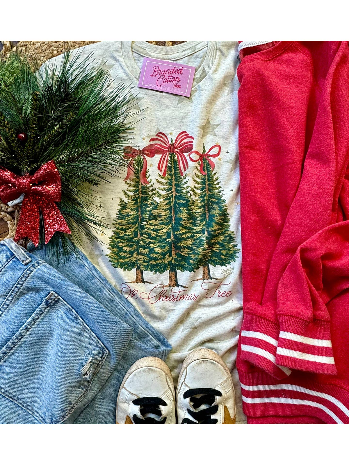 Natural unisex tee with three Christmas trees topped with red bows and 'Oh Christmas Tree' text.
