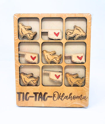 Wooden Oklahoma Tic-Tac-Toe board featuring Bigfoot and Oklahoma state-shaped playing pieces.