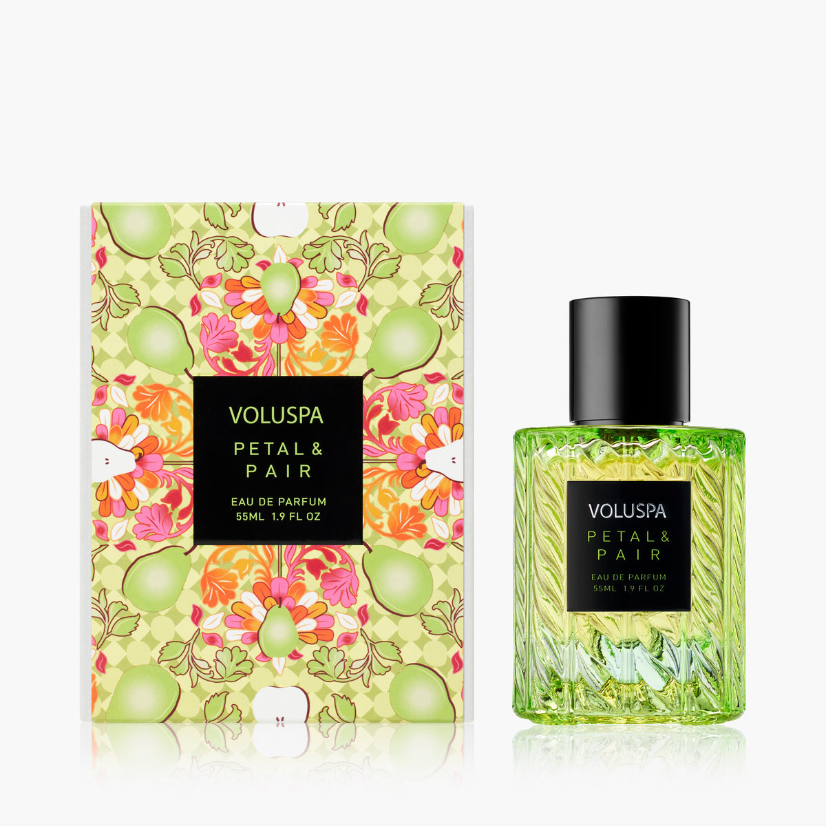 Voluspa Petal & Pair 55ml Eau De Parfum in a green sculpted glass bottle next to its patterned box.
