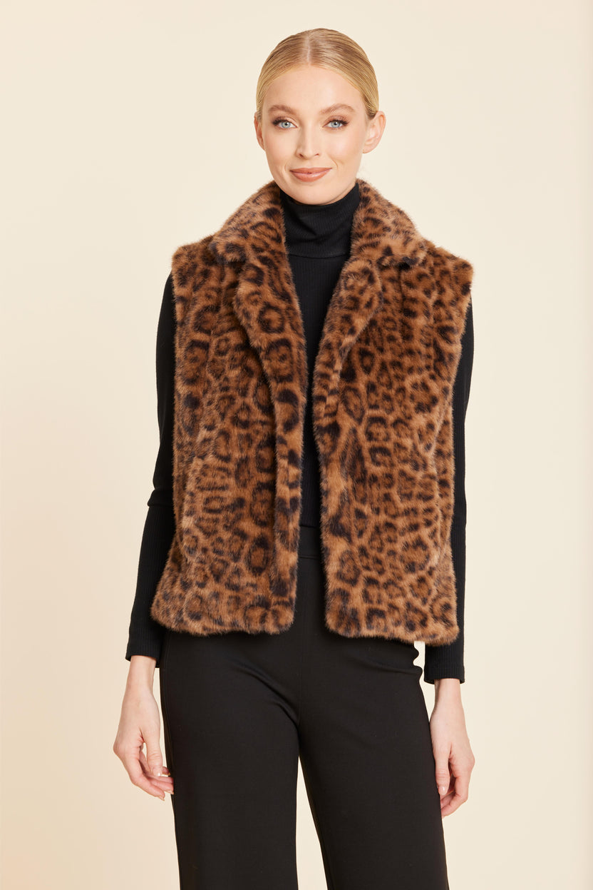 Woman wearing the Naomi Plush Faux Fur Notch Collar Vest in a leopard print over a black turtleneck.