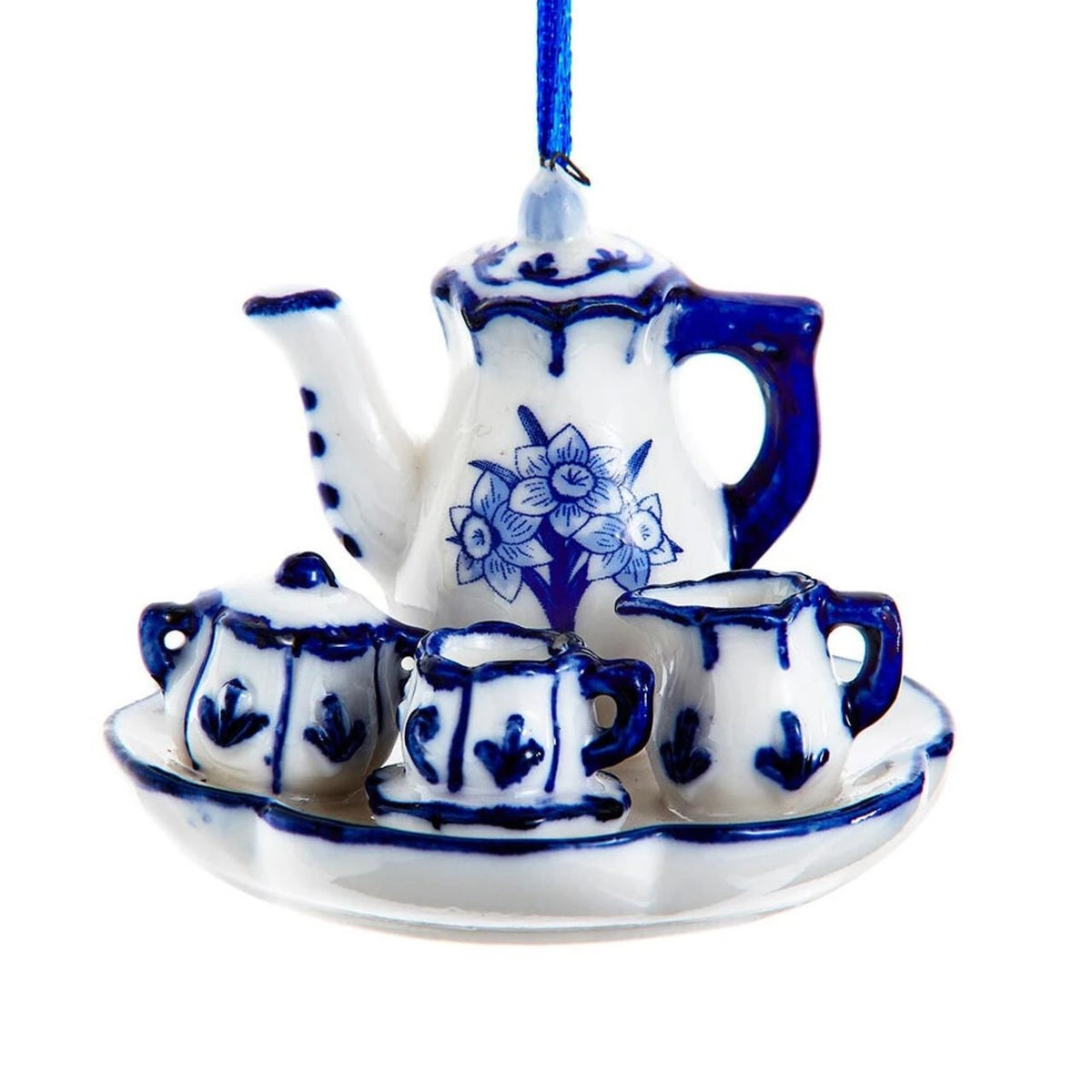 Miniature blue and white porcelain tea set ornament with a teapot, cups, and tray.