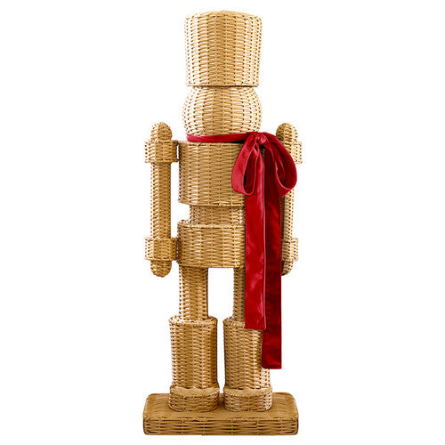 48-inch tall woven synthetic rattan nutcracker with a red velvet bow on a rectangular base.