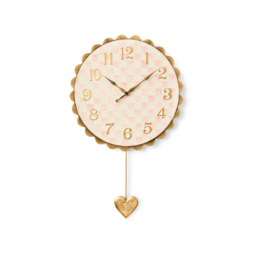 Rosy Check Heart Pendant Clock with pink checkered face, brass scalloped trim, and heart pendulum.