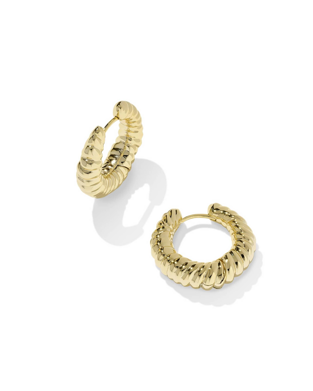 A pair of gold Sandy Hoop Earrings with a thick, sculptural, and textured ribbed design.