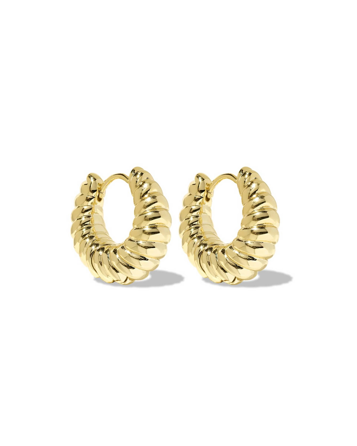 A pair of gold Sandy Huggie Earrings with a thick, sculptural twisted texture.