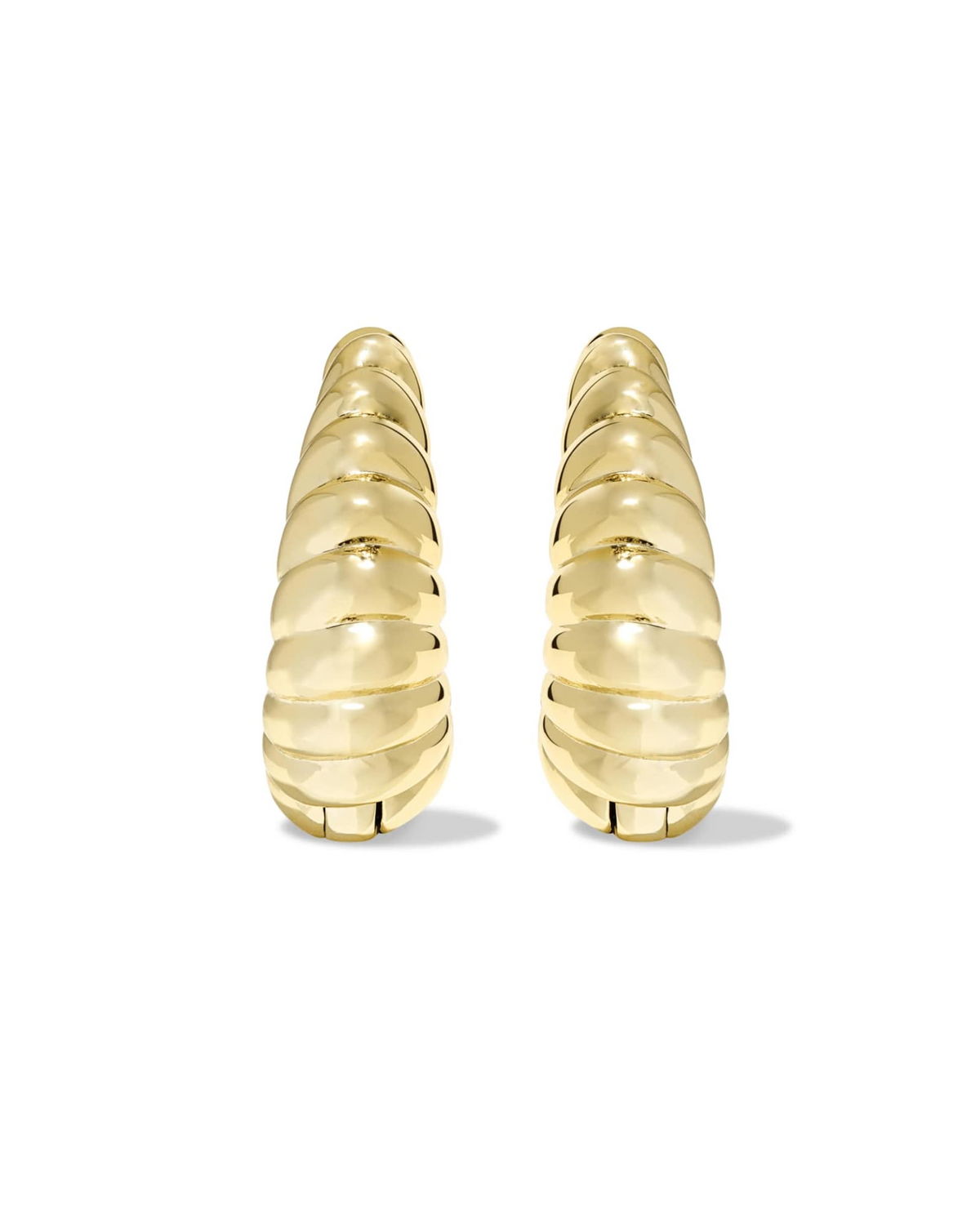 A pair of gold Sandy Huggie Earrings featuring a bold, sculptural ribbed texture.
