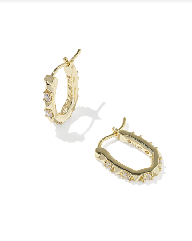 Gold Fate Huggie Earrings featuring an oval shape with small clear crystals and spiked accents.