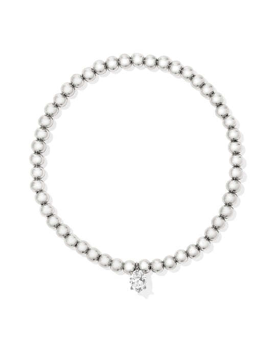 White CZ stretch bracelet with dainty crystal charm on yellow gold over brass