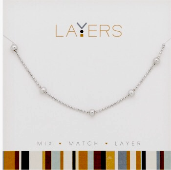 Silver decorative ball layers necklace with mixed chain lengths