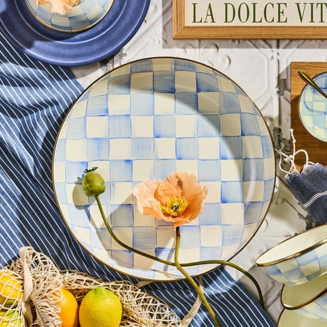Hand-glazed steel abundant bowl with hand-painted sky blue checks pattern on a bronzed stainless-steel rim.