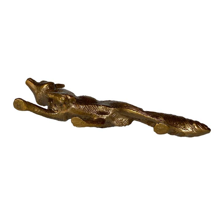 Solid antiqued brass running fox sculpture with etched detailing for tabletop or desk decor.