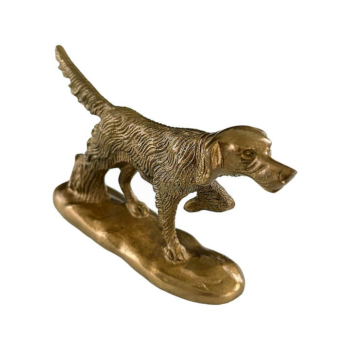 Solid brass pointer dog paperweight with an antiqued finish on a matching base.