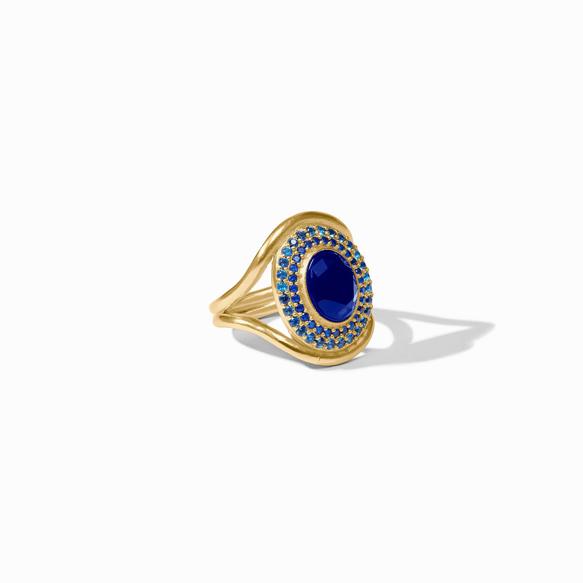 Stardust Statement Ring in 24K gold plate with an oval iridescent sapphire blue glass center.