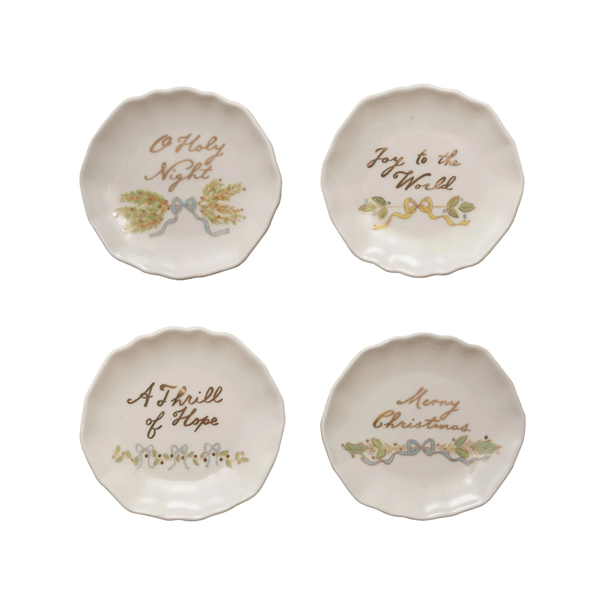 Four white scalloped stoneware plates with gold holiday phrases and festive botanical designs.