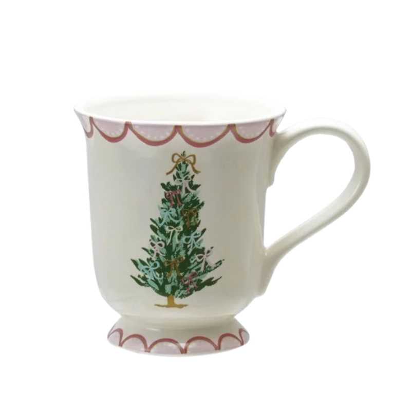 White stoneware mug with a green Christmas tree and pink scalloped borders on the rim and base.