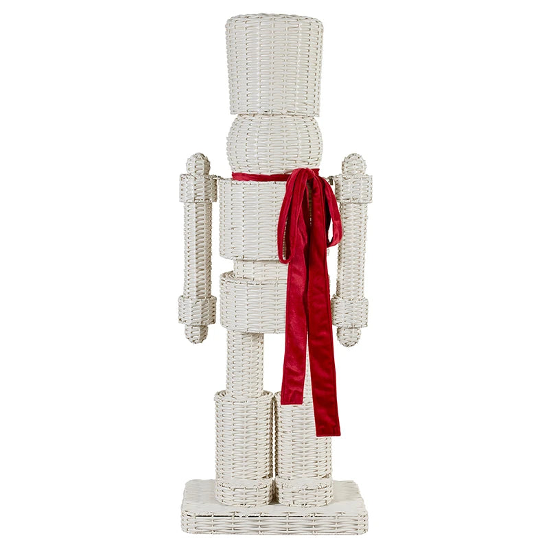 White woven nutcracker with red velvet bow