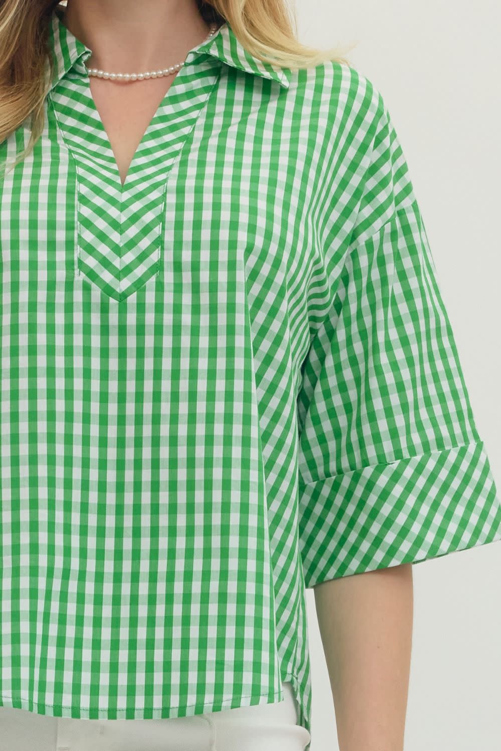 Green gingham print cotton top with split V-neck collar and buttoned cuffs