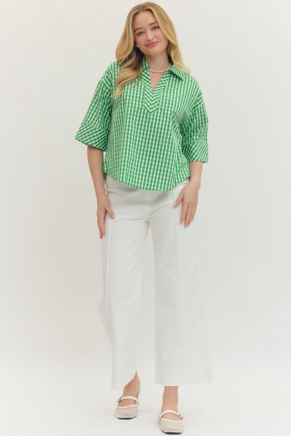 Green gingham print Pamela top with split V-neck collar and buttoned cuffs.