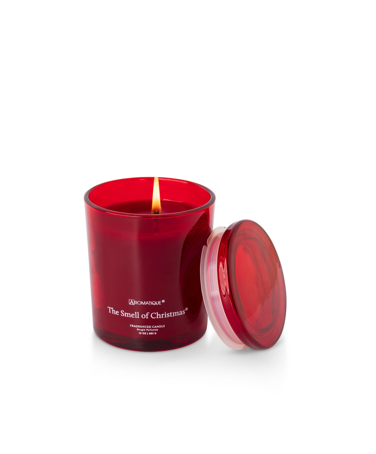 The Smell of Christmas 10 oz candle in a red glass vessel with a lit wick and matching lid.