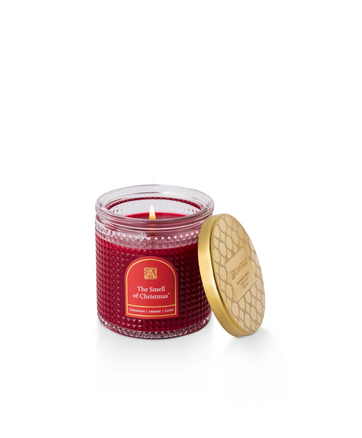 The Smell of Christmas red textured glass candle with a gold patterned metal lid.