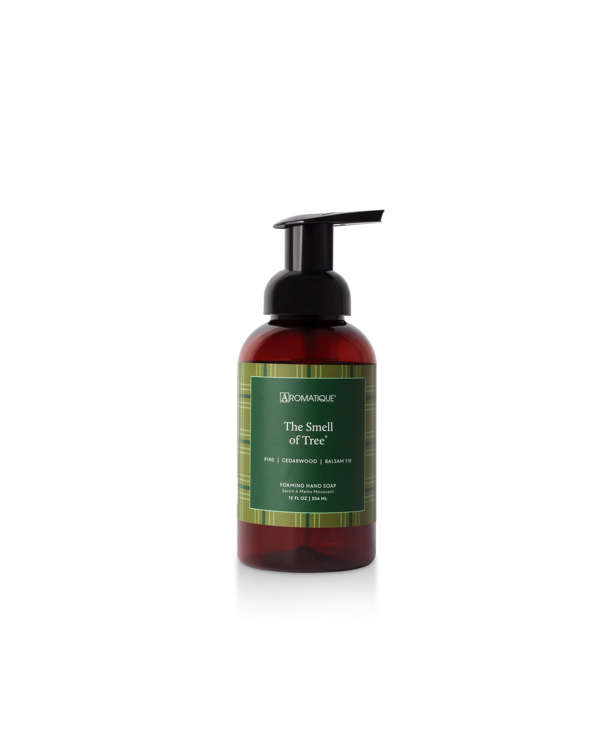 The Smell of Tree Foaming Hand Soap in an amber bottle with a green plaid label and black pump.